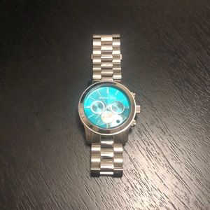 Silver with teal face MK watch